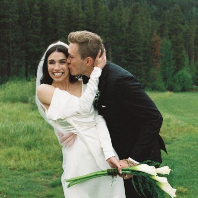 Brenden kissing his wife, Grace at their wedding in Colorado.